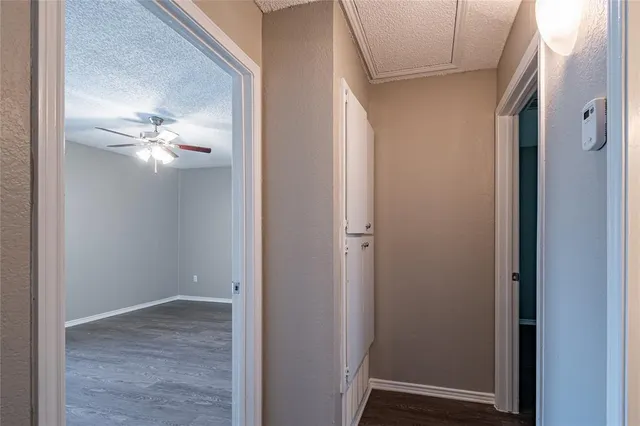 a view of a chandelier fan and entryway