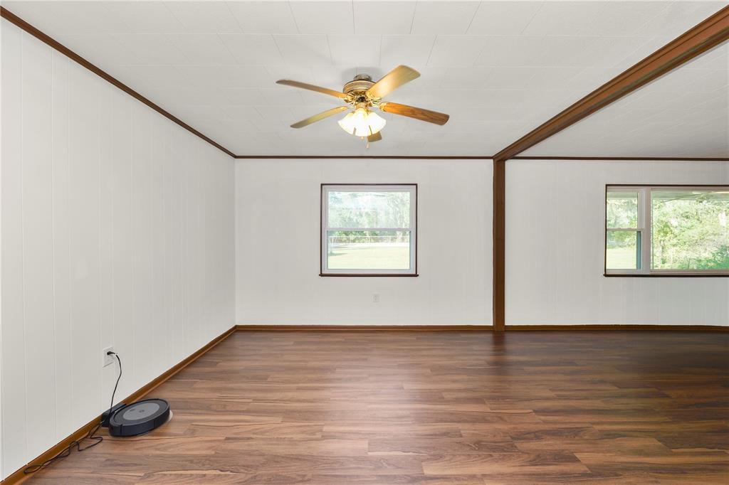 4615 Old Polk City Road Lakeland, FL 33809 - Photo 11 of 71 a view of an empty room with window and wooden floor