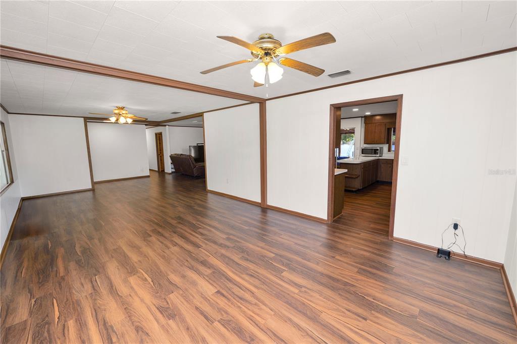 4615 Old Polk City Road Lakeland, FL 33809 - Photo 12 of 71 a view of an empty room and wooden floor