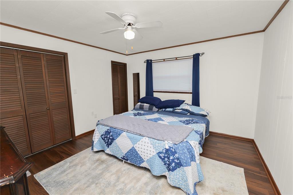 4615 Old Polk City Road Lakeland, FL 33809 - Photo 29 of 71 a bed sitting in a bedroom next to a window
