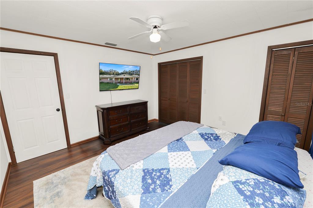 4615 Old Polk City Road Lakeland, FL 33809 - Photo 30 of 71 a bedroom with a bed and a dresser
