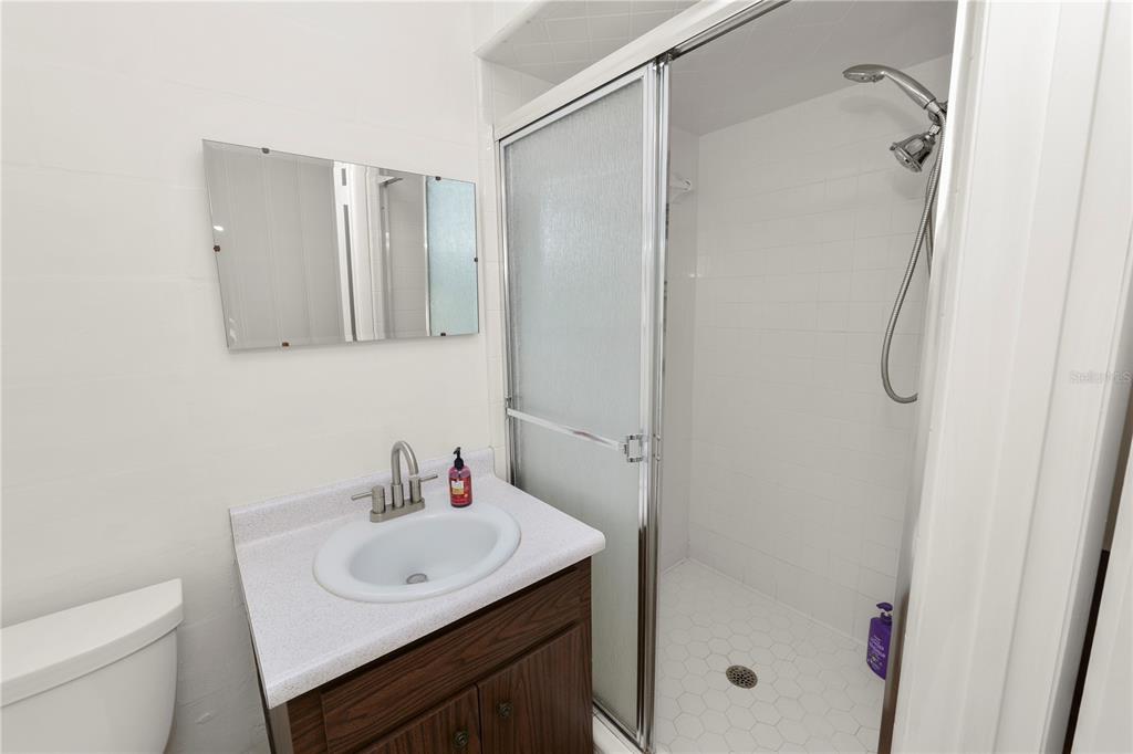 4615 Old Polk City Road Lakeland, FL 33809 - Photo 36 of 71 a bathroom with a sink toilet and shower