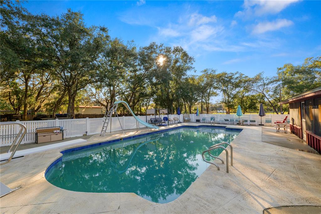 4615 Old Polk City Road Lakeland, FL 33809 - Photo 40 of 71 a view of a swimming pool with a patio