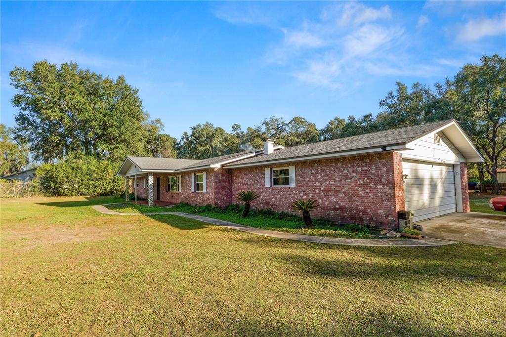 4615 Old Polk City Road Lakeland, FL 33809 - Photo 58 of 71 front view of a house with a yard
