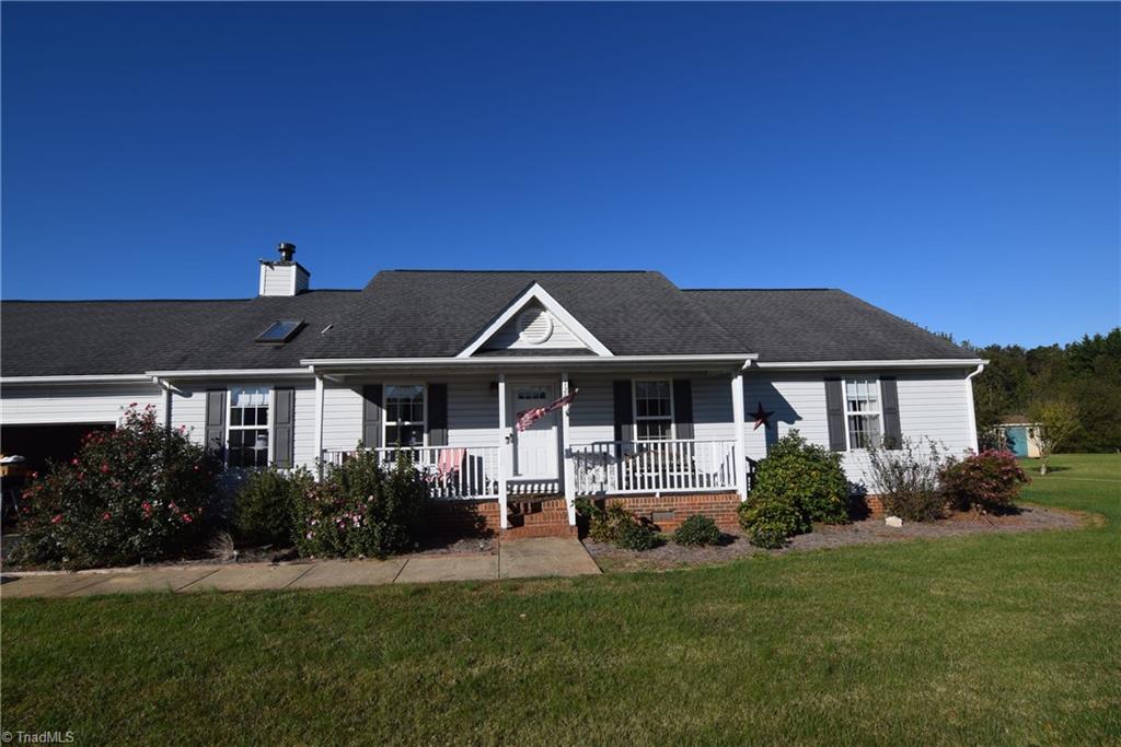 7207 Friendship Church Road Browns Summit, NC 27214 - Photo 2 of 49 Enjoy your rocking chair front porch