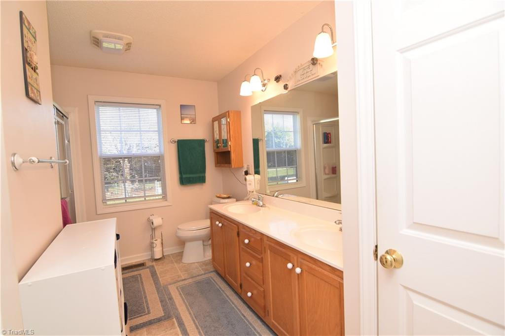 7207 Friendship Church Road Browns Summit, NC 27214 - Photo 18 of 49 Primary private bathroom with dual vanities