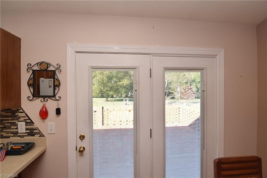 7207 Friendship Church Road Browns Summit, NC 27214 - Photo 10 of 49 Glass doors to brick patio