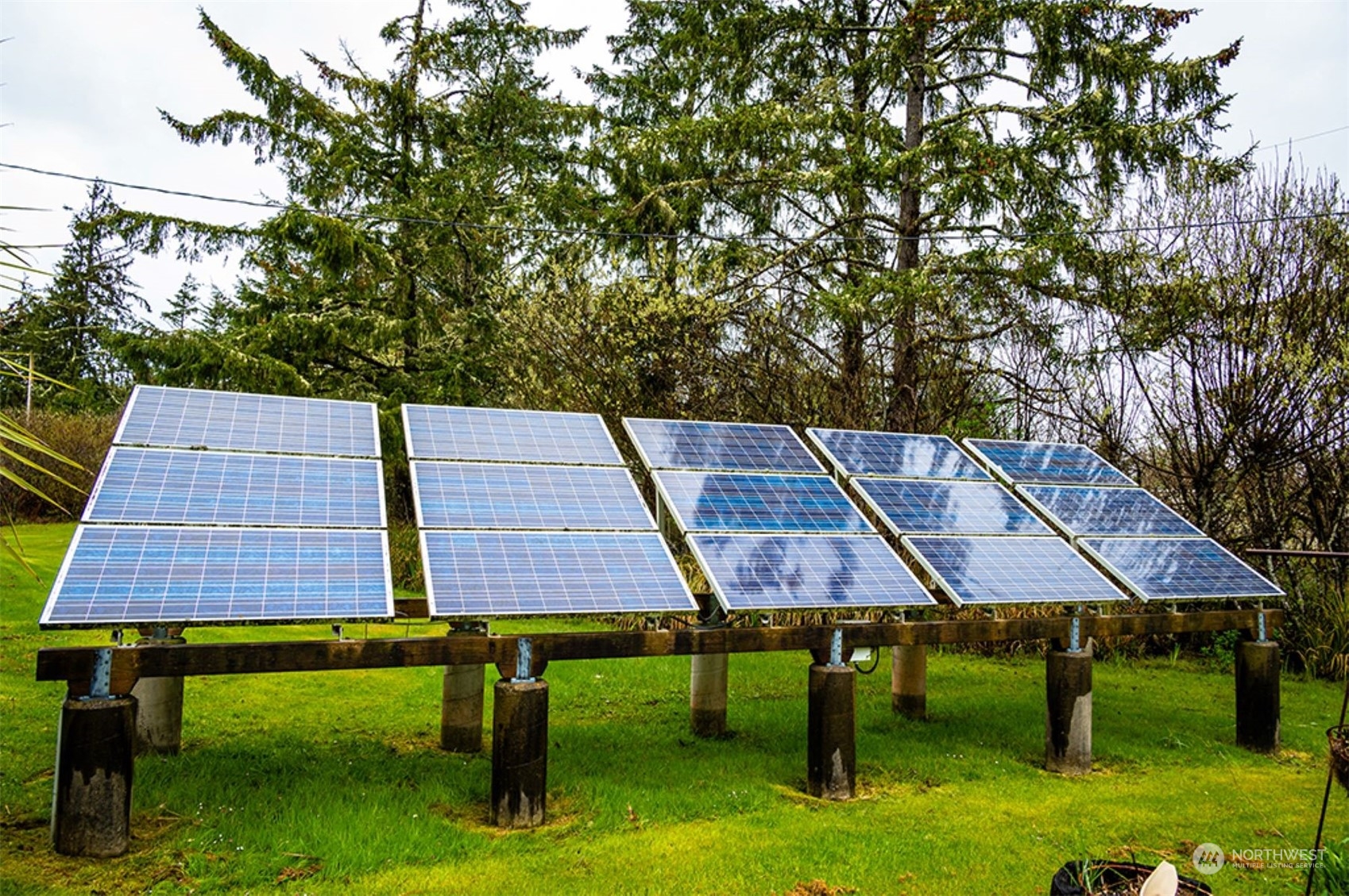 11 Condra Road Copalis Beach, WA 98535 - Photo 20 of 24 a aerial view of a table and chairs under an umbrella