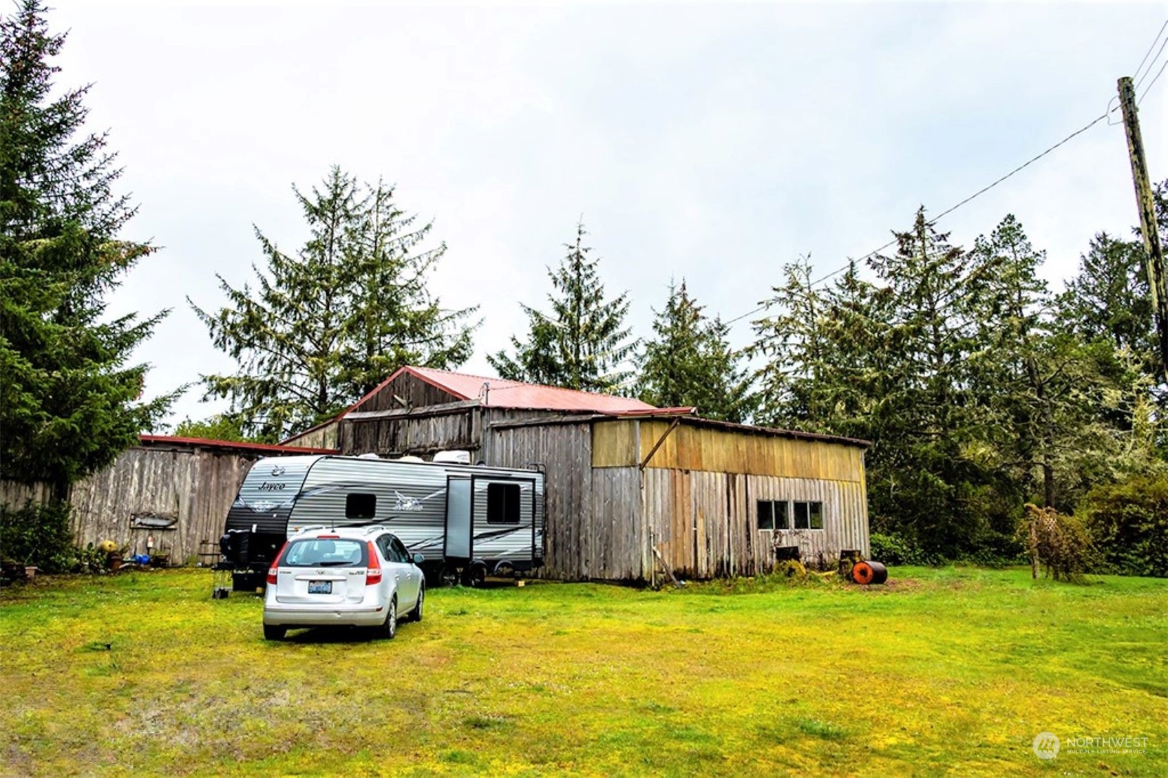 11 Condra Road Copalis Beach, WA 98535 - Photo 22 of 24 a front view of house with yard barbeque oven and outdoor seating