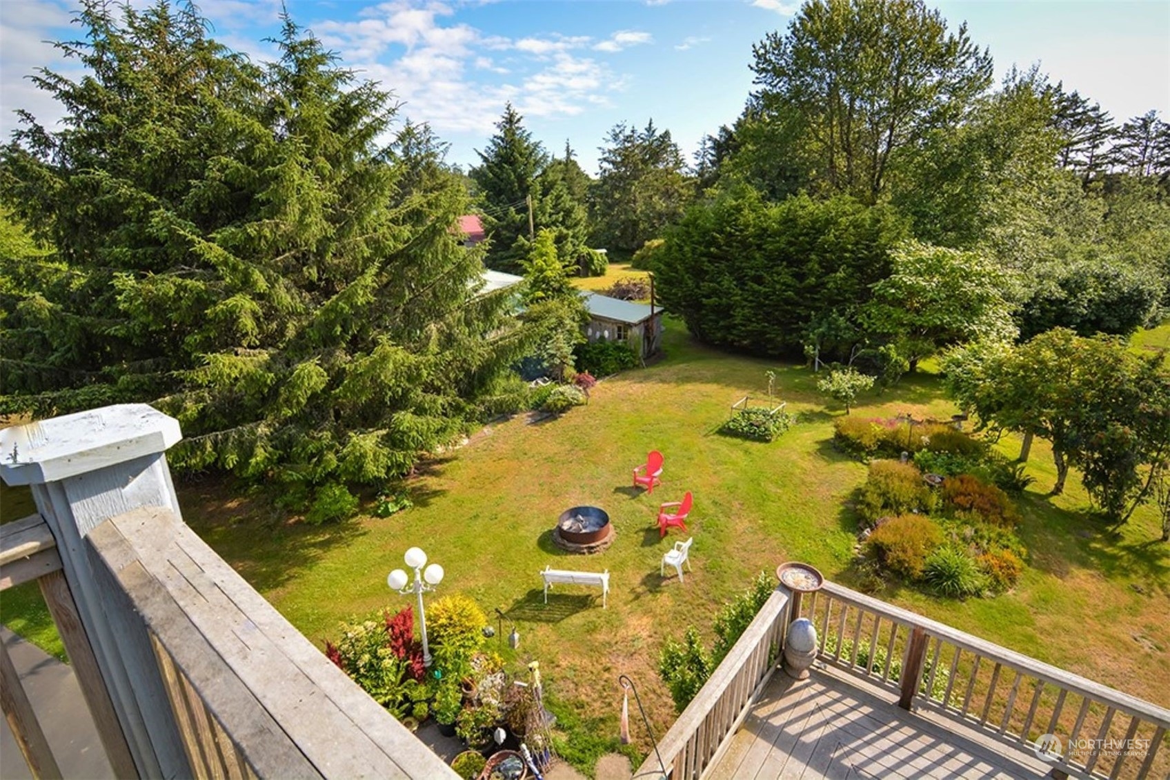 11 Condra Road Copalis Beach, WA 98535 - Photo 6 of 24 a view of a balcony with wooden floor and yard