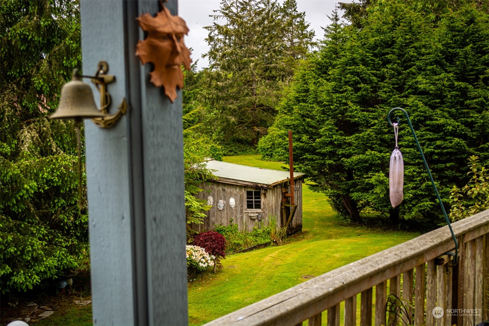 11 Condra Road Copalis Beach, WA 98535 - Photo 7 of 24 a view of a patio with table and chairs and a large tree