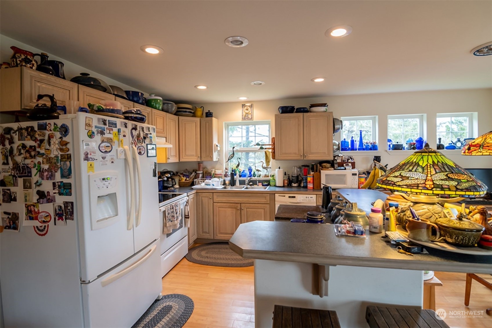 11 Condra Road Copalis Beach, WA 98535 - Photo 10 of 24 a kitchen with stainless steel appliances granite countertop a refrigerator and a sink
