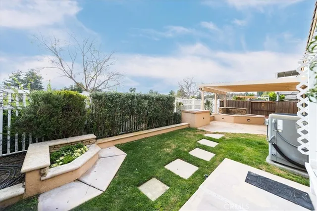 a view of a garden with furniture