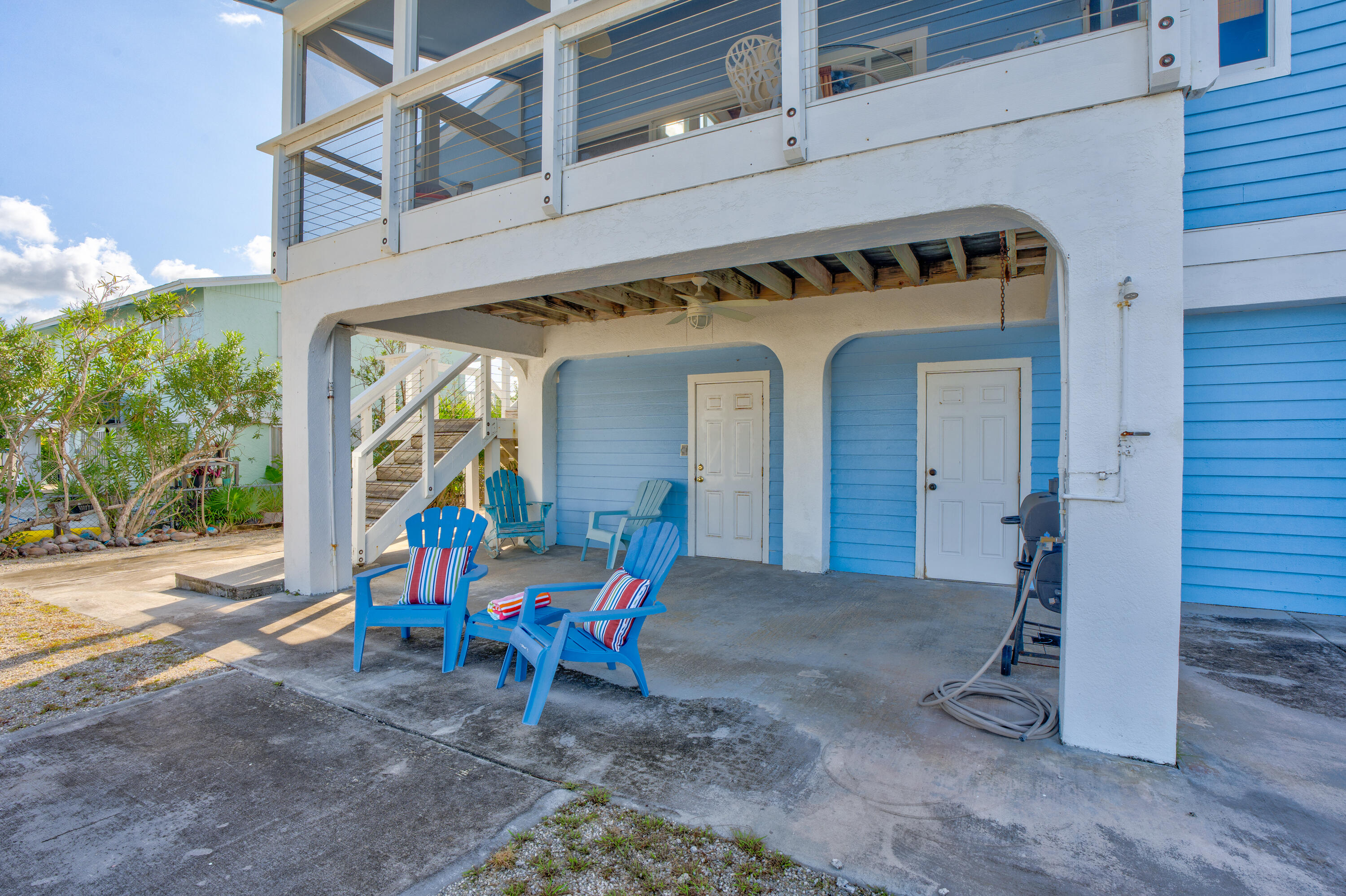 3831 Sunset Drive Big Pine Key, FL 33043 - Photo 47 of 59 a view of a two chair in the patio
