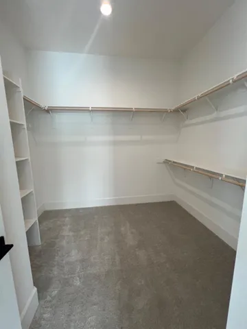 a view of an empty walk in closet