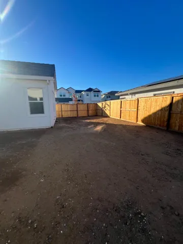 a view of an empty room with a fireplace