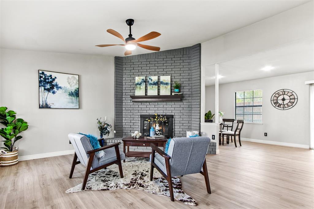 2137 Rose Hill Road Carrollton, TX 75007 - Photo 1 of 1 a living room with furniture and wooden floor