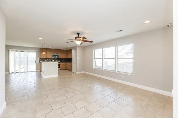 a view of a kitchen with a sink and a window