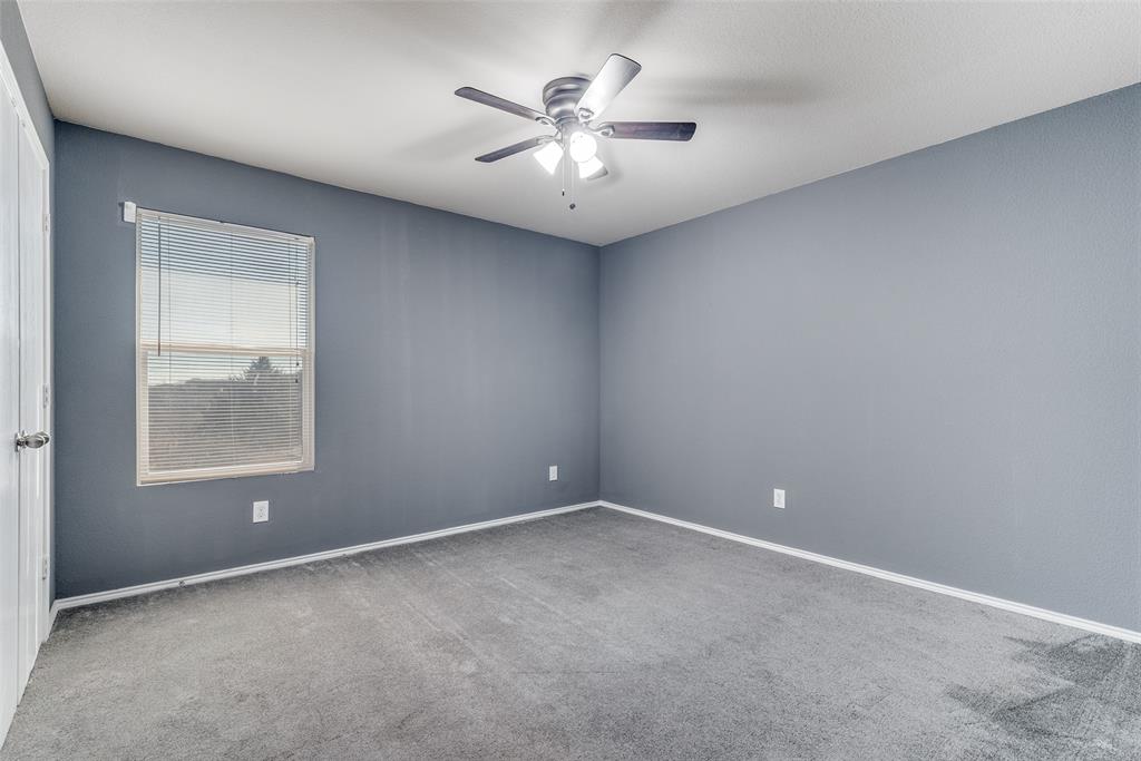 2541 Grand Gulf Road Fort Worth, TX 76123 - Photo 18 of 25 an empty room with windows and fan