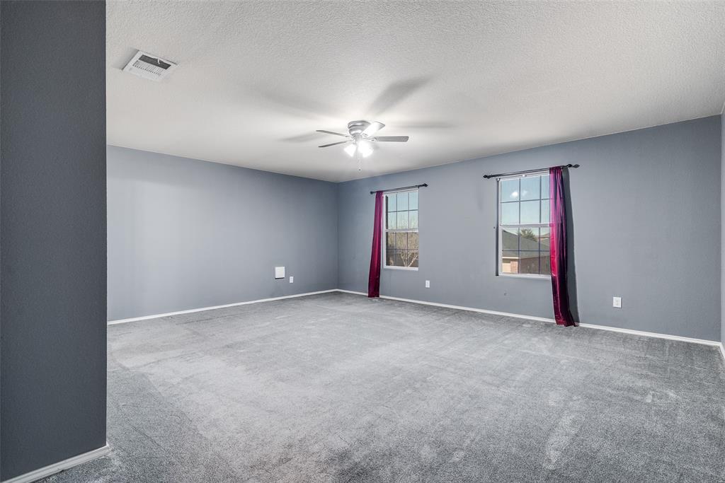 2541 Grand Gulf Road Fort Worth, TX 76123 - Photo 20 of 25 a view of an empty room with chandelier fan and window