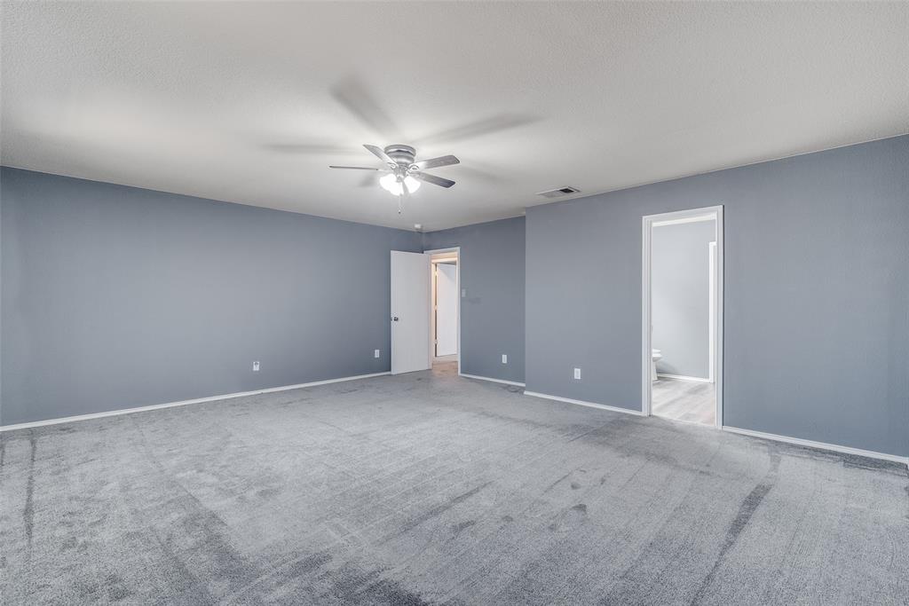 2541 Grand Gulf Road Fort Worth, TX 76123 - Photo 21 of 25 a view of an empty room with a fan