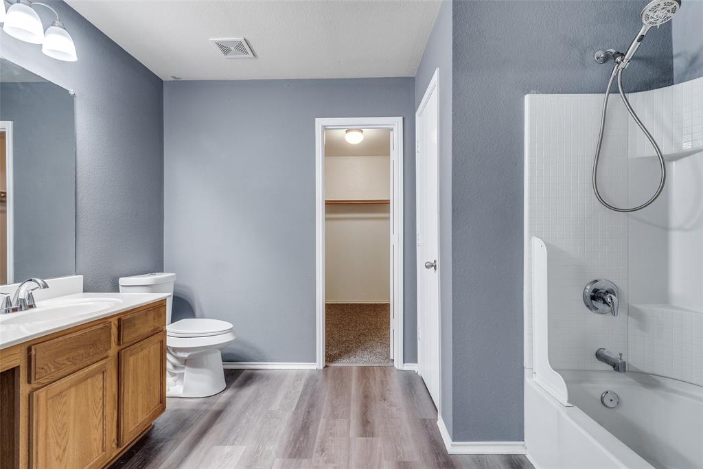 2541 Grand Gulf Road Fort Worth, TX 76123 - Photo 22 of 25 a bathroom with a granite countertop sink toilet and shower