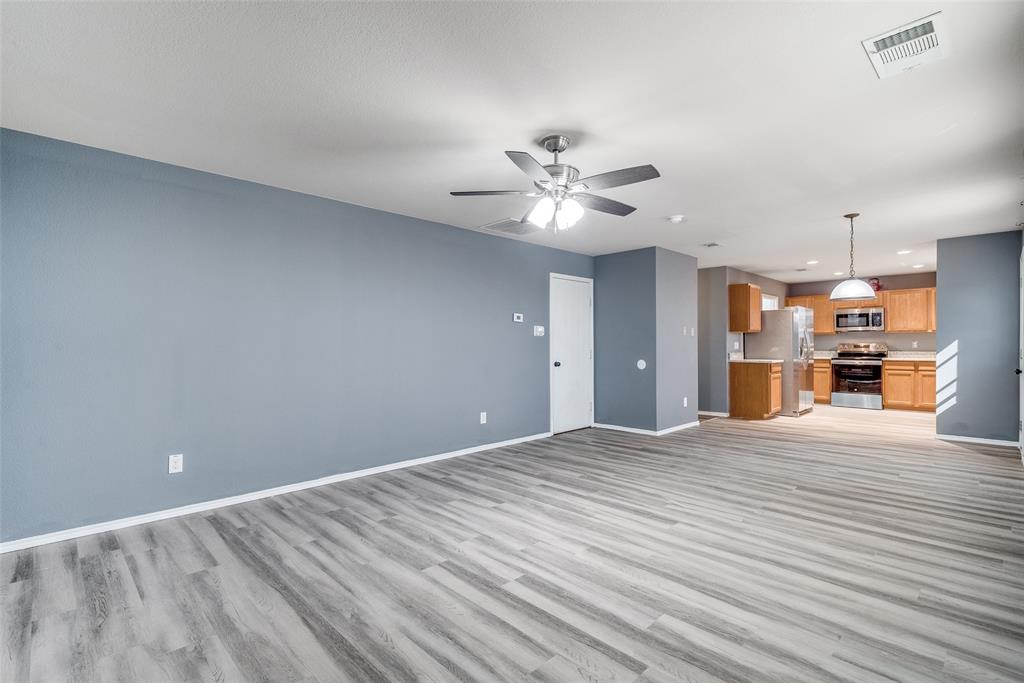 2541 Grand Gulf Road Fort Worth, TX 76123 - Photo 5 of 25 a view of an empty room with a kitchen