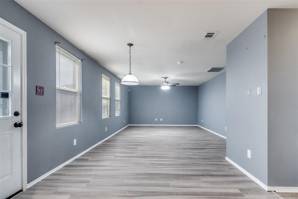 2541 Grand Gulf Road Fort Worth, TX 76123 - Photo 9 of 25 a view of an empty room with window and wooden floor