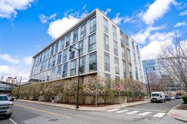 a city street lined with buildings and cars