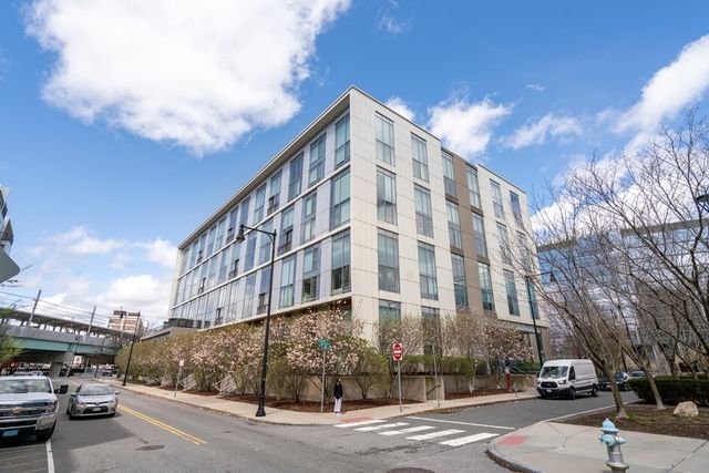 a city street lined with buildings and cars
