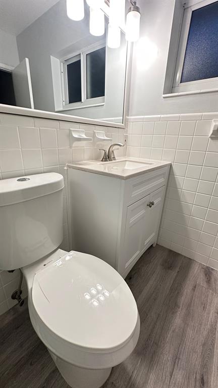 1911 Northeast 28th Court, Unit 2B Lighthouse Point, FL 33064 - Photo 11 of 17 a bathroom with a sink and a mirror