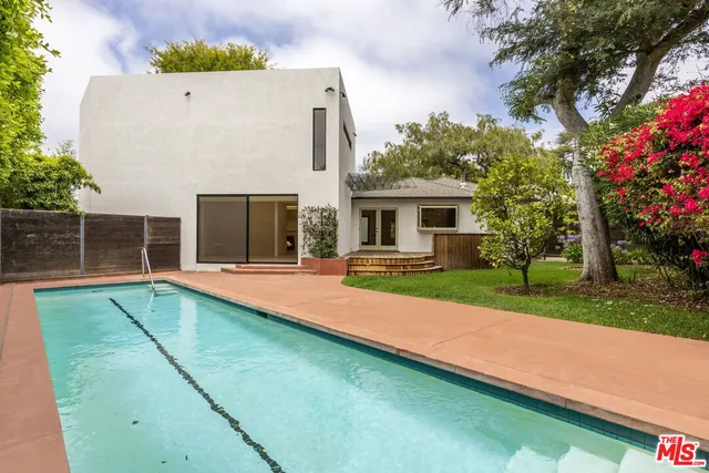 a view of house with yard outdoor seating and barbeque oven