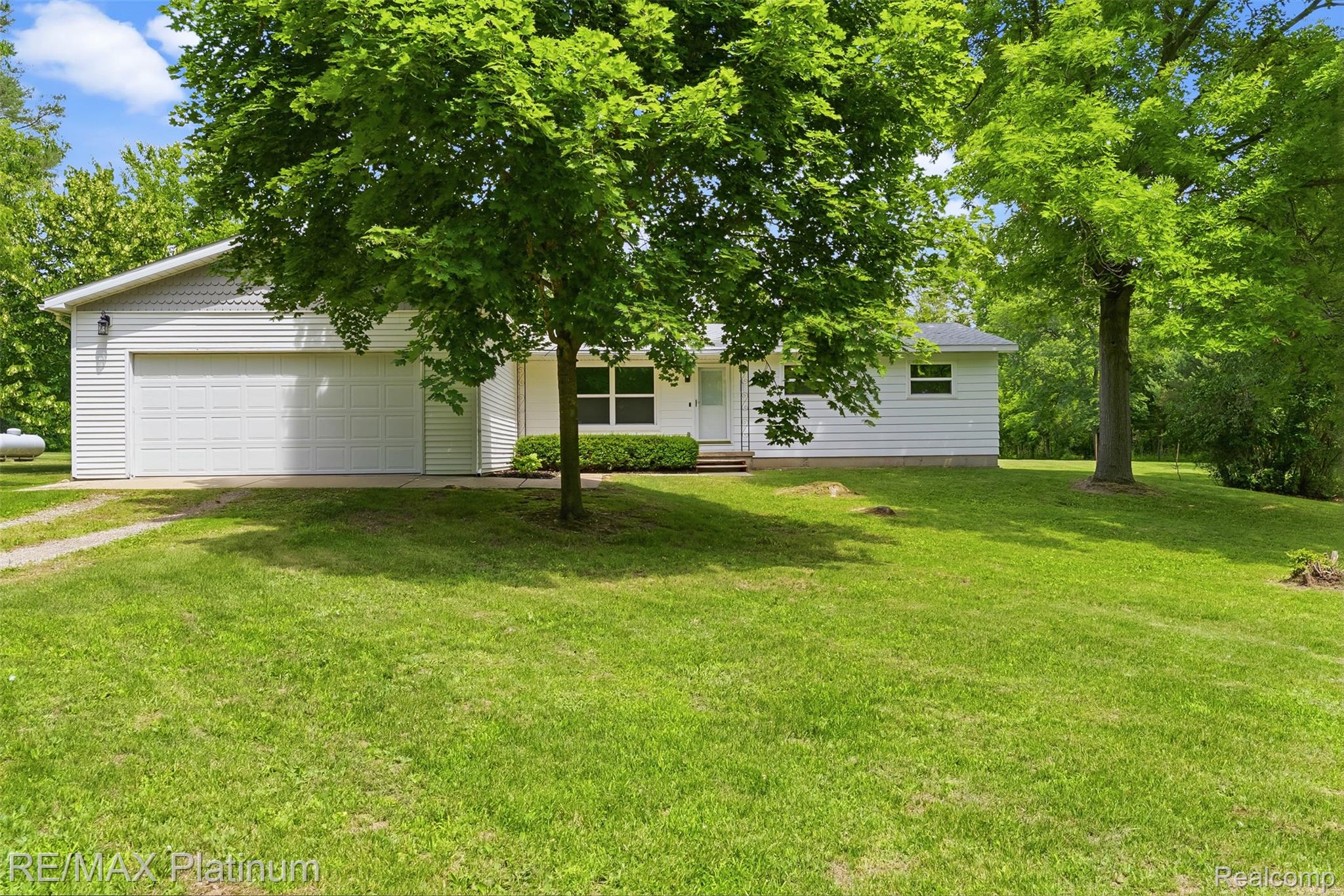 8370 West Rolston Road Linden, MI 48451 - Photo 1 of 36 Single-story residence featuring white siding and an attached two-car garage