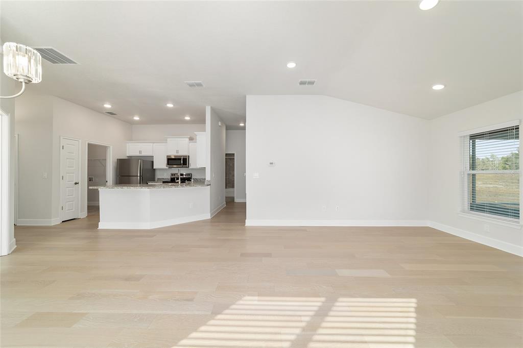 4373 Northeast 31st Street Ocala, FL 34470 - Photo 12 of 51 a view of a kitchen with a sink and a refrigerator