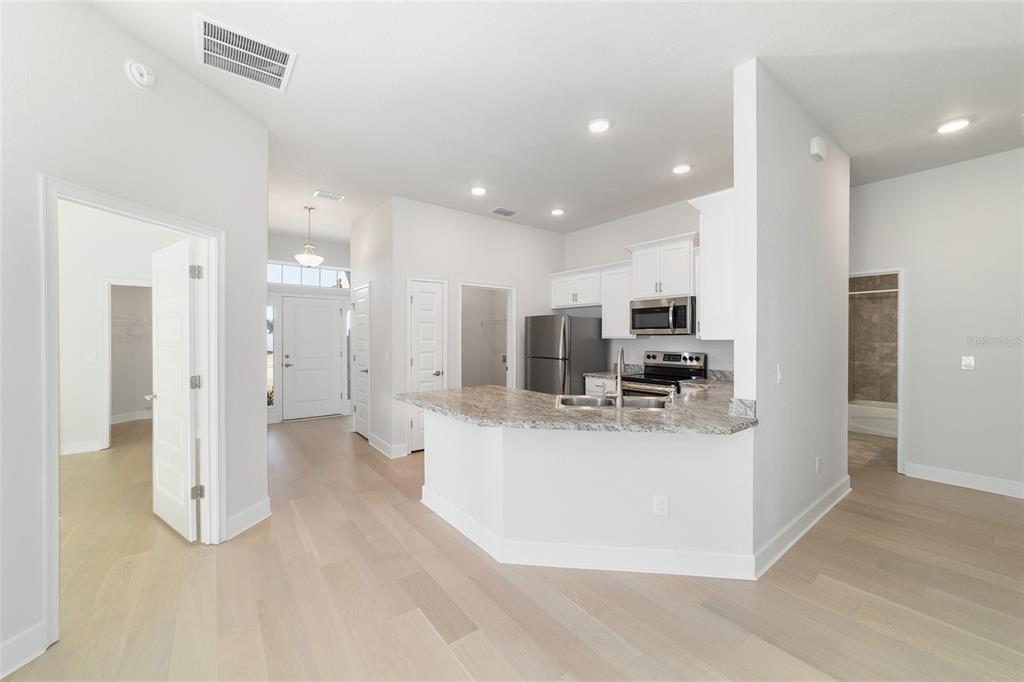4373 Northeast 31st Street Ocala, FL 34470 - Photo 15 of 51 a view of kitchen with refrigerator and microwave