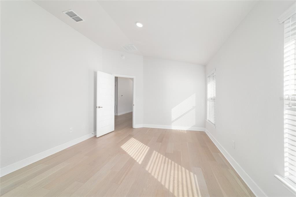 4373 Northeast 31st Street Ocala, FL 34470 - Photo 24 of 51 a view of a big room with wooden floor and windows