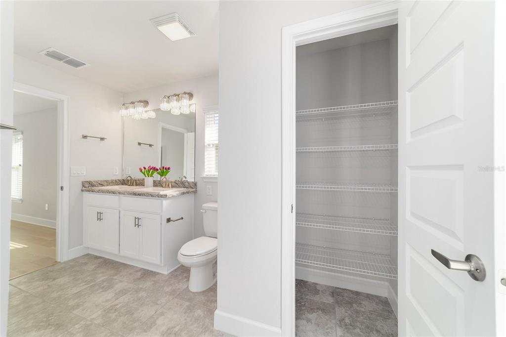 4373 Northeast 31st Street Ocala, FL 34470 - Photo 28 of 51 a bathroom with a granite countertop sink toilet and shower