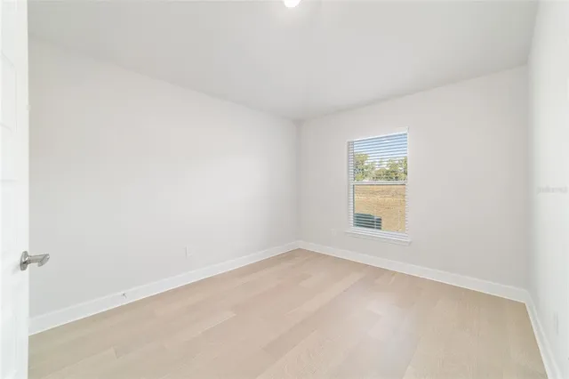 a bathroom with a granite countertop sink mirror toilet and bathtub
