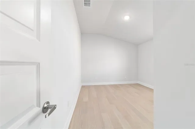 an empty room with closet area