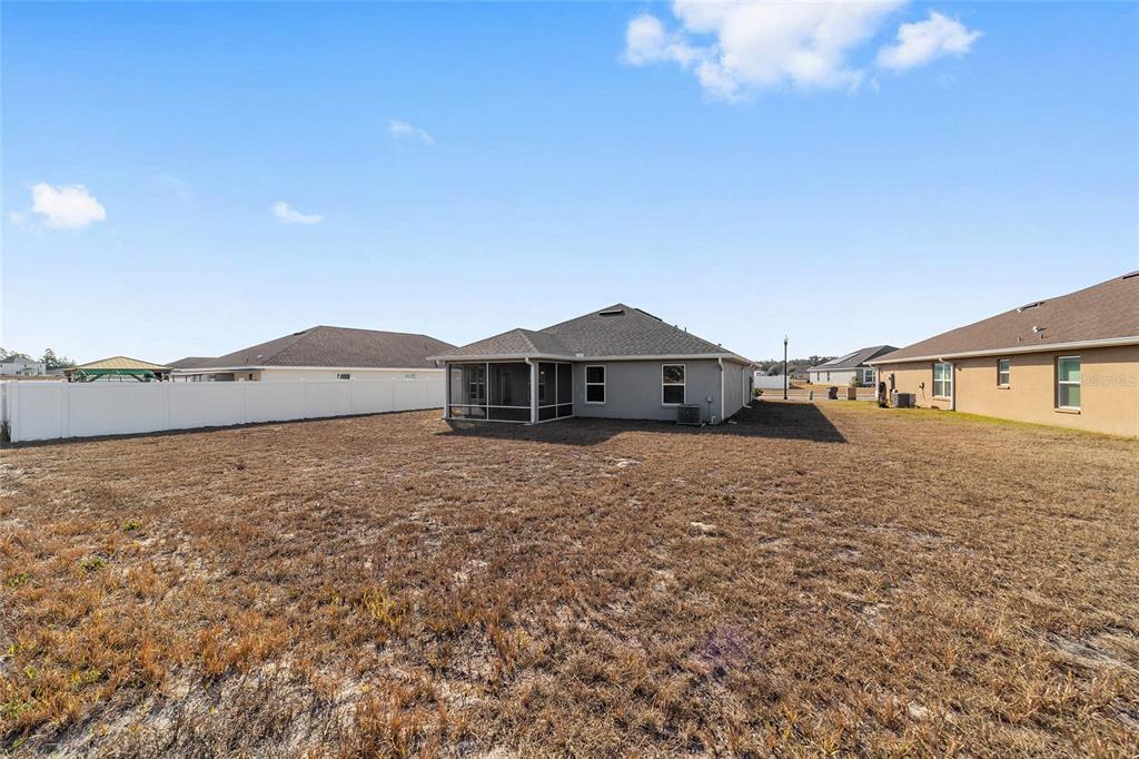 4373 Northeast 31st Street Ocala, FL 34470 - Photo 47 of 51 a front view of a house with a yard