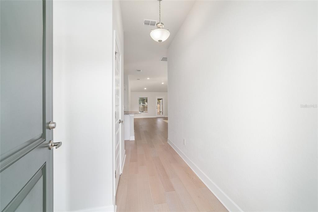 4373 Northeast 31st Street Ocala, FL 34470 - Photo 7 of 51 a view of a hallway with a white cabinet