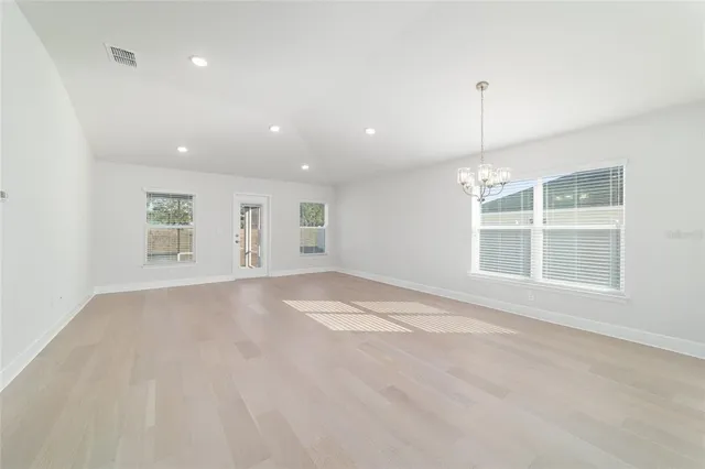 a view of a kitchen with a sink stainless steel appliances and cabinets