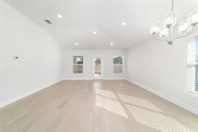 a view of a kitchen with a sink and a refrigerator