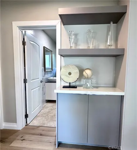 a kitchen with a refrigerator a stove and cabinets