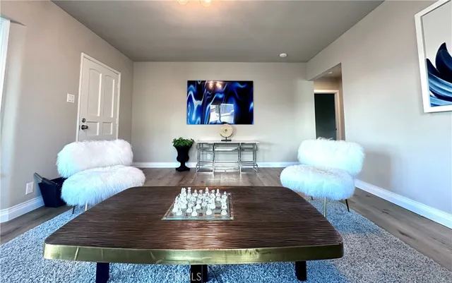 a living room with furniture and a rug