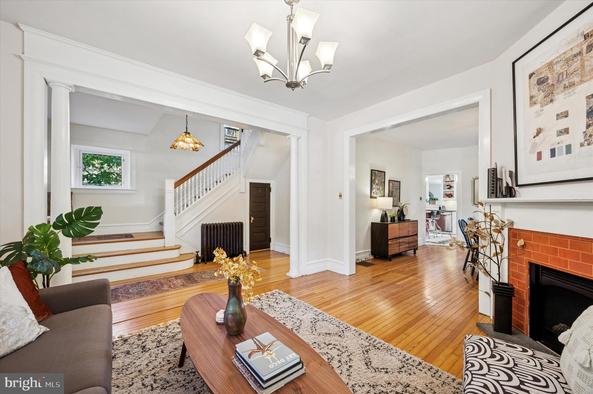 200 East Gravers Lane Philadelphia, PA 19118 - Photo 11 of 57 a living room with furniture a fireplace and a chandelier