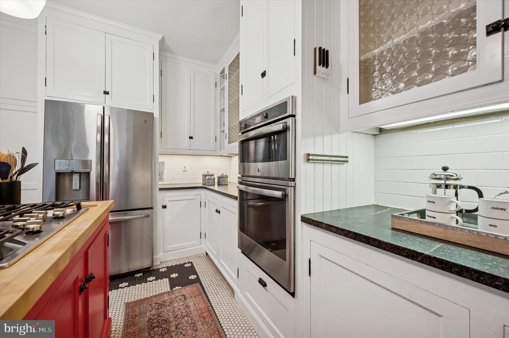 200 East Gravers Lane Philadelphia, PA 19118 - Photo 18 of 57 a kitchen with stainless steel appliances a refrigerator stove and sink