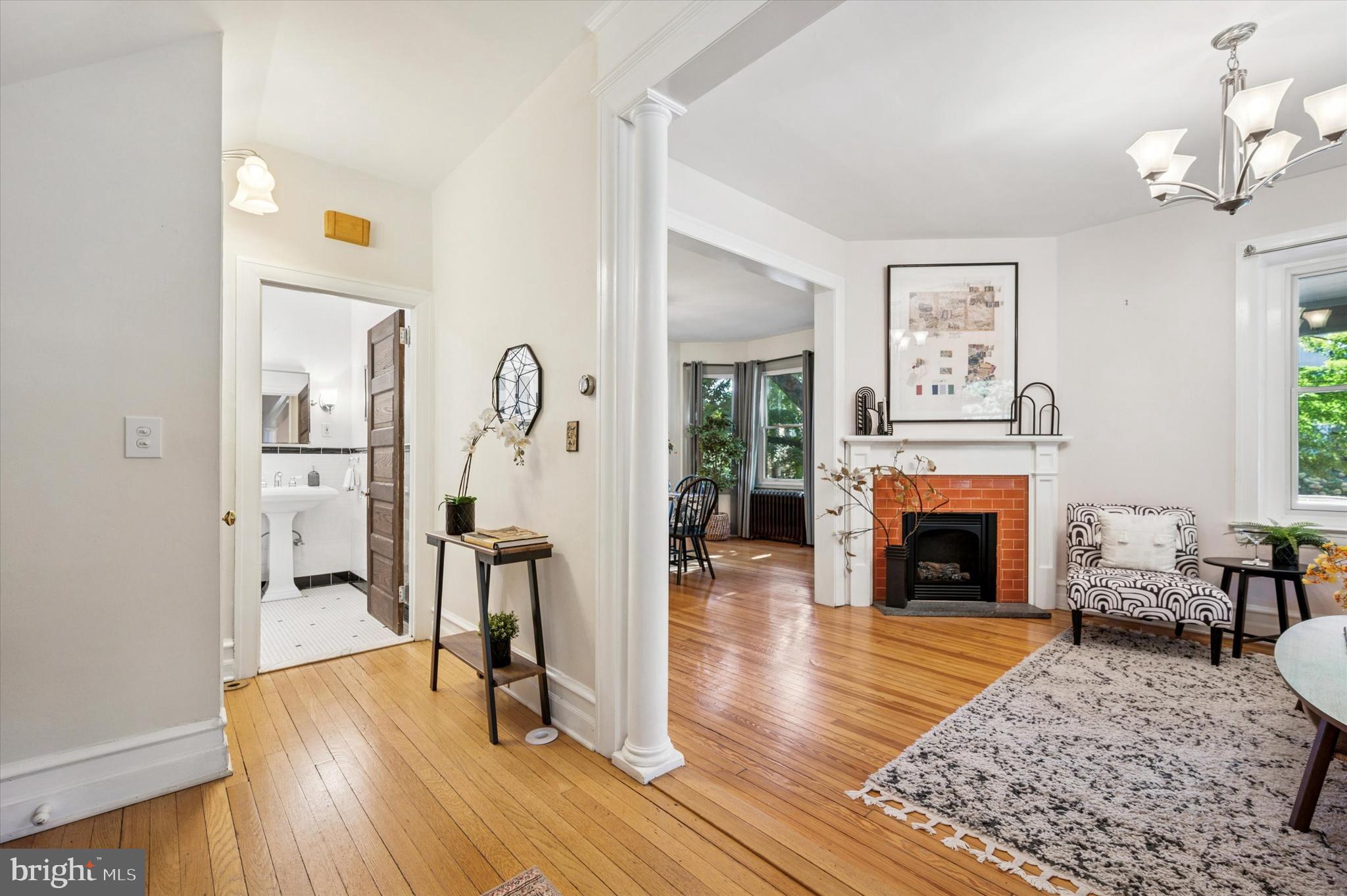 200 East Gravers Lane Philadelphia, PA 19118 - Photo 24 of 57 a living room with fireplace furniture and a wooden floor