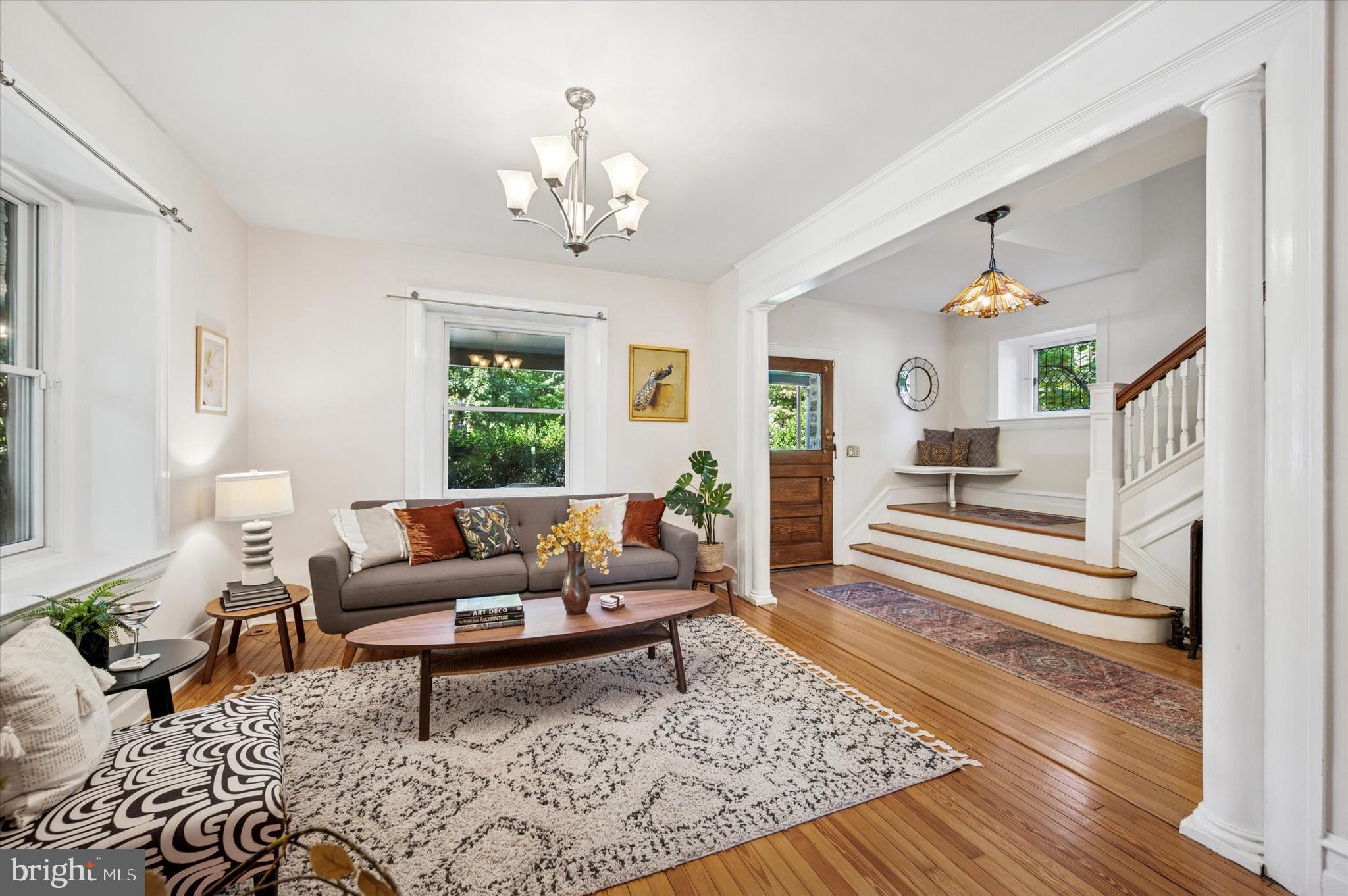 200 East Gravers Lane Philadelphia, PA 19118 - Photo 10 of 57 a living room with furniture and a chandelier