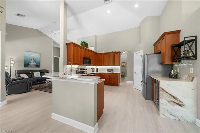 a kitchen with cabinets and a couch